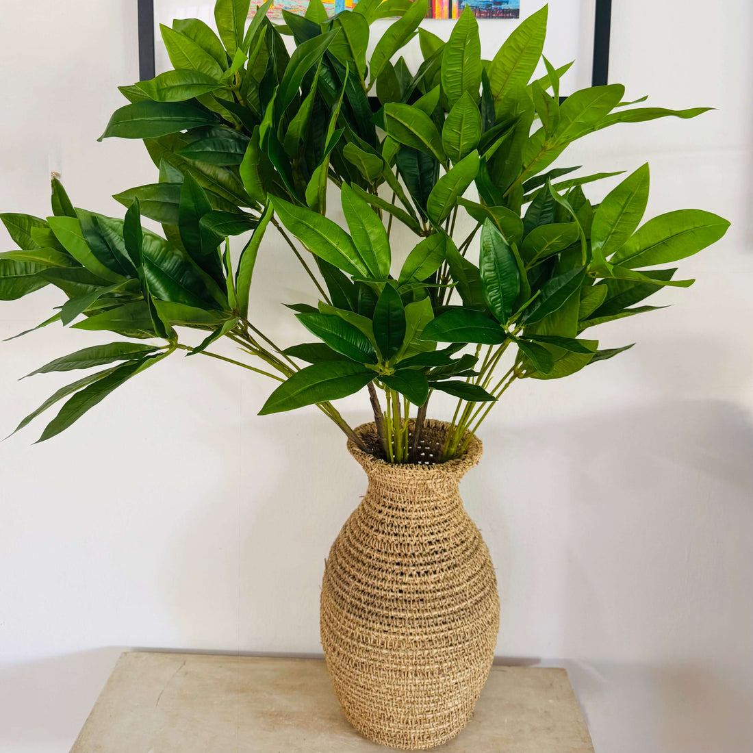 vase of branches of artificial foliage