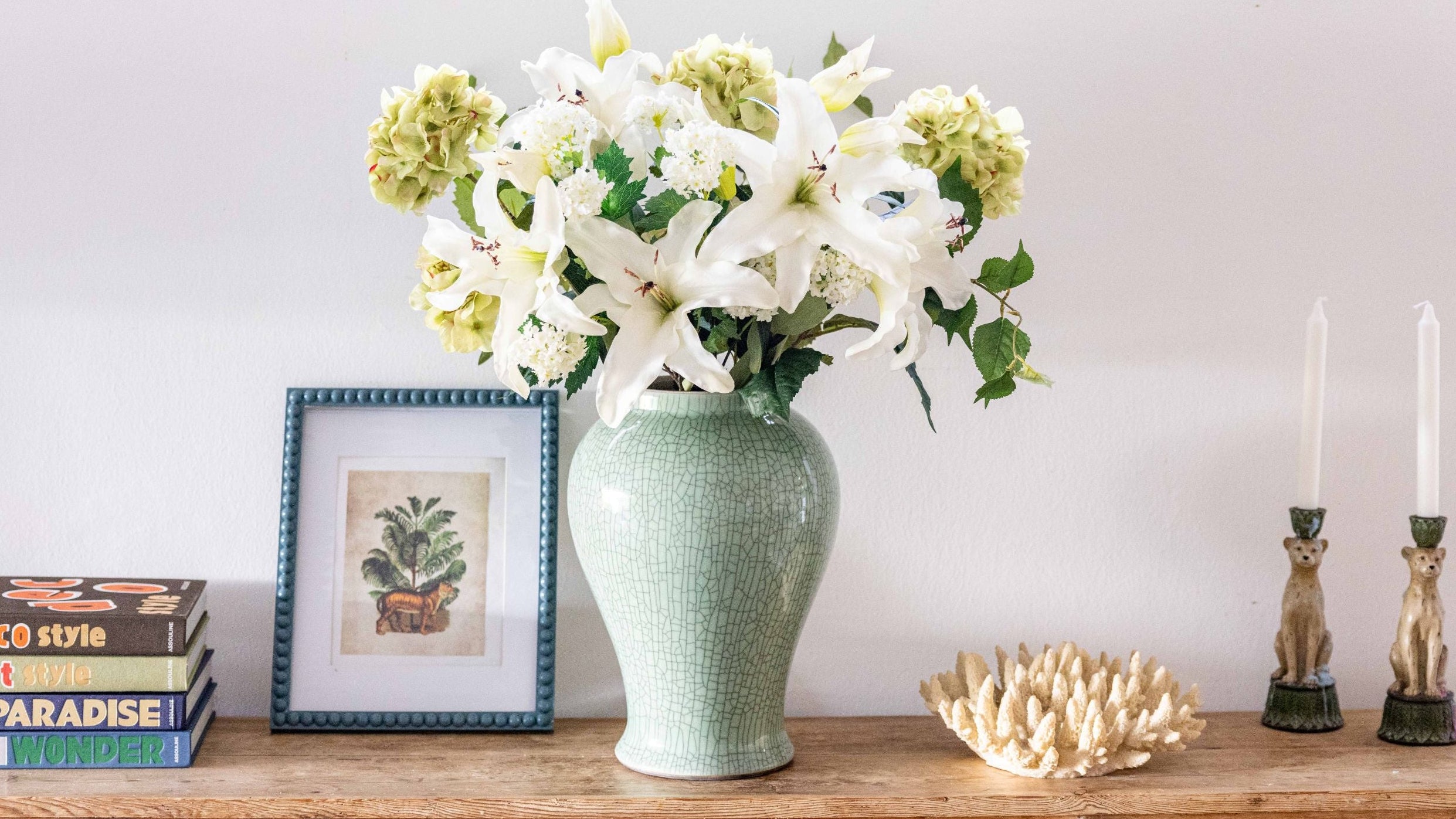 large floral arrangement in green vase