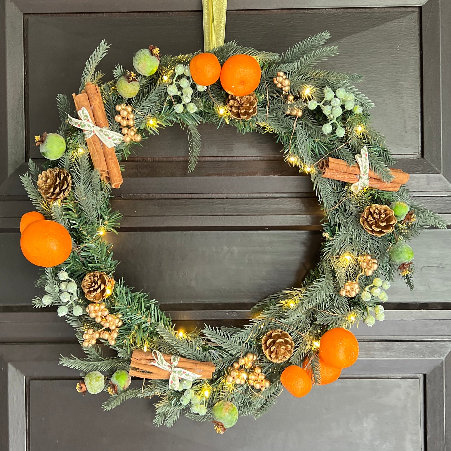 Festive orange and berry wreath
