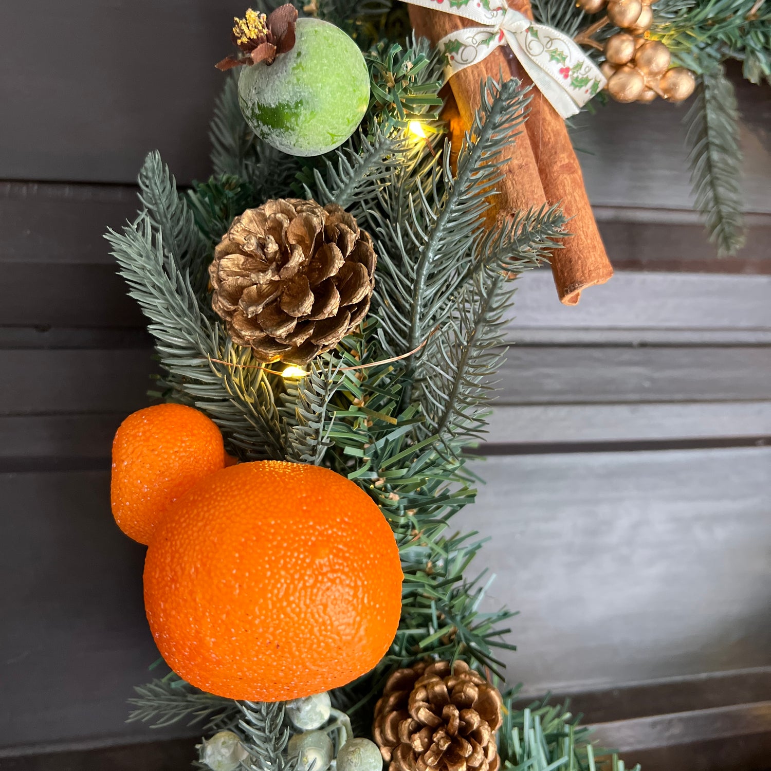 Festive orange and berry wreath
